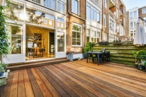 view of a custom deck connected to a house.