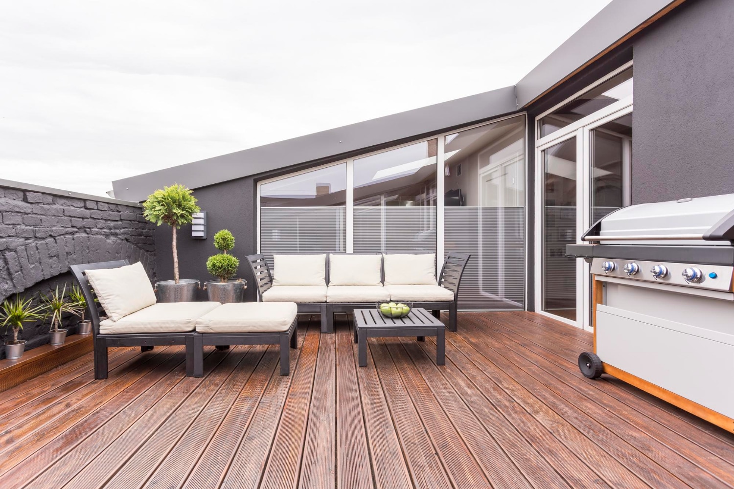 view of a composite deck connected to a house.