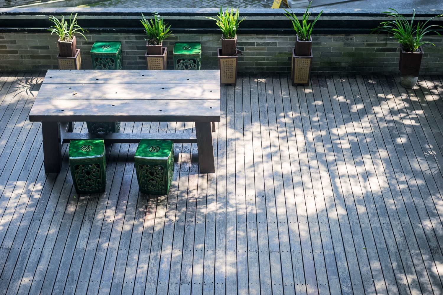 Aerial view of a gray deck in the shade.